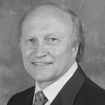 A gray portrait of a man wearing a formal attire