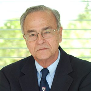 Gustavo D Aguirre in a Dark Color Suit Portrait Image